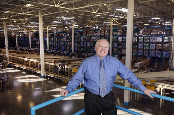 Melaleuca CEO Frank VanderSloot watches operations at the company’s Idaho Falls distribution center, where millions of products are boxed and shipped to customers around the country each month. (Steve Smede photo)